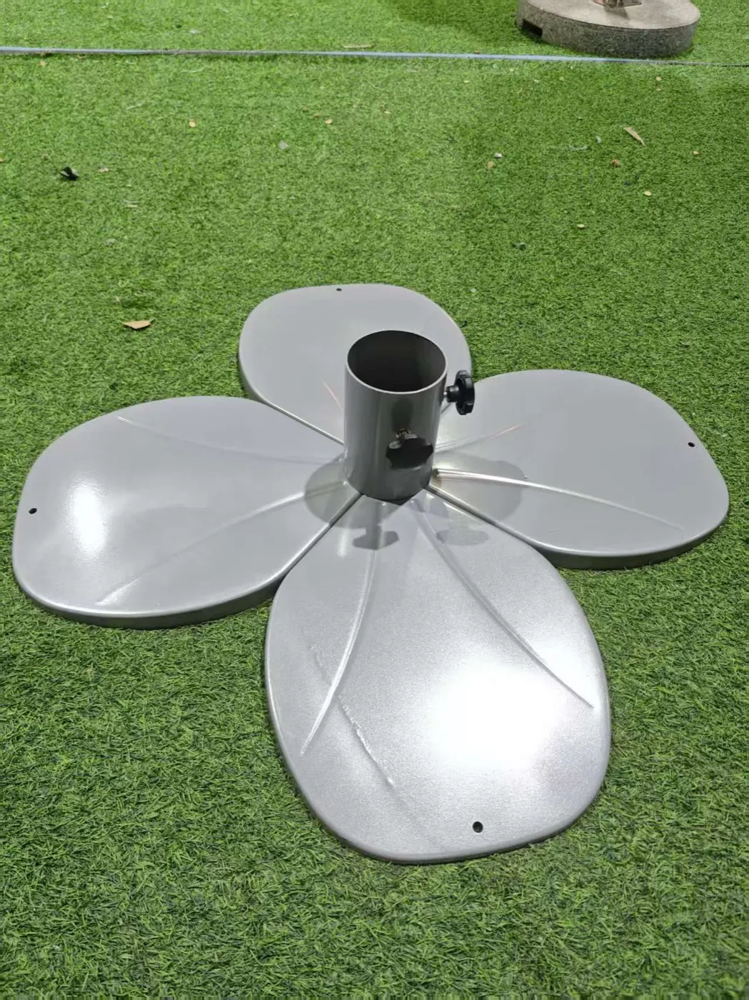 Five-petal flower base of a torch umbrella before assembly